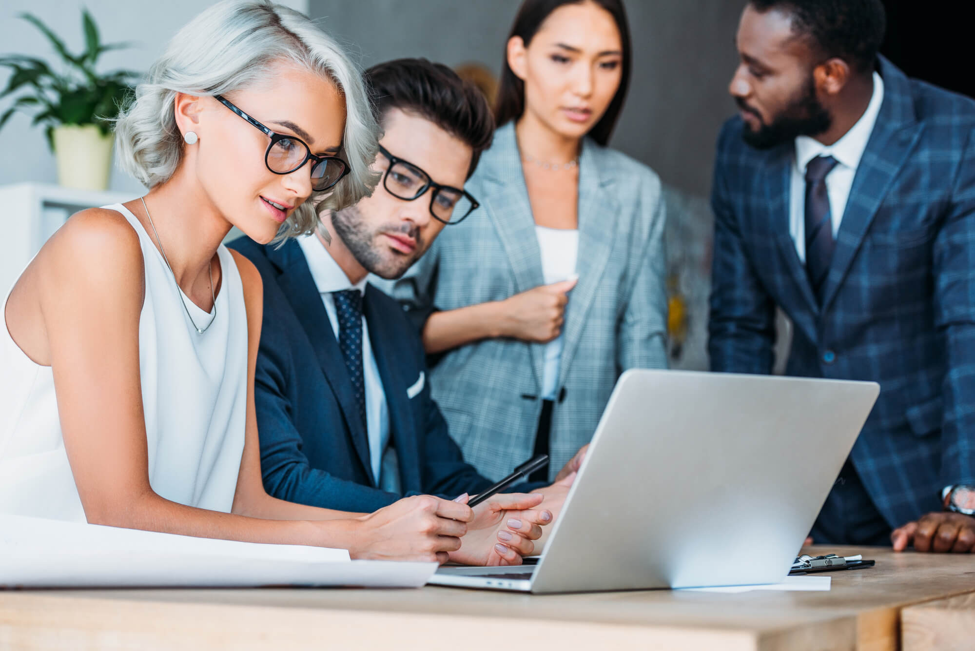 image of 2 professionals looking at a laptop