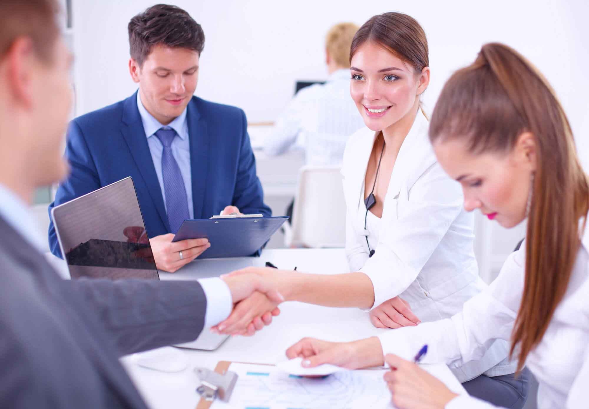 Business people shaking hands, finishing up a meeting